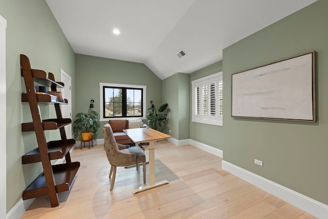 office area featuring lofted ceiling and light wood-type flooring