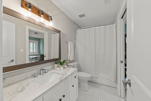 full bathroom with vanity, tile patterned flooring, toilet, and shower / tub combo with curtain