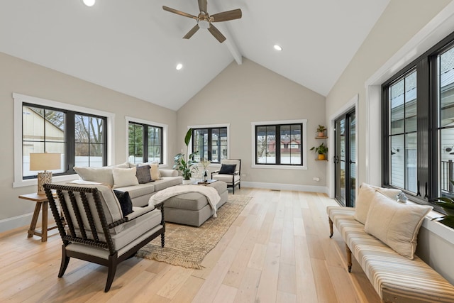 living room featuring high vaulted ceiling, beam ceiling, light hardwood / wood-style floors, and ceiling fan