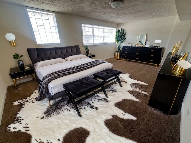 bedroom with carpet flooring and a textured ceiling