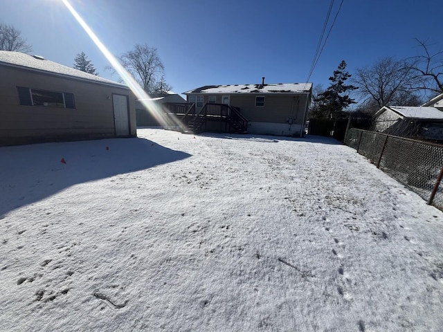 view of yard layered in snow