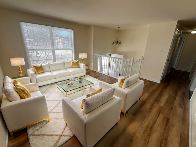 living room featuring a chandelier and hardwood / wood-style flooring