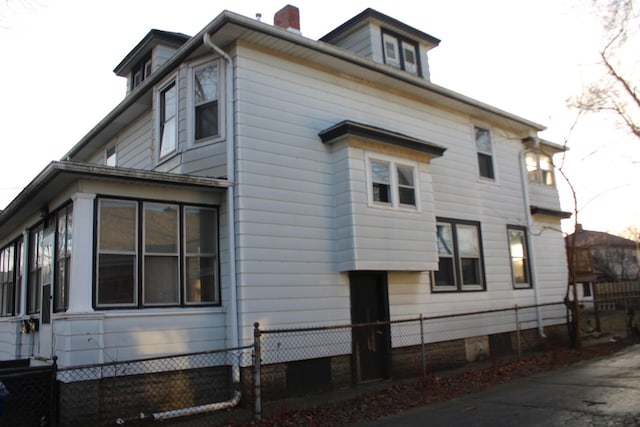 view of home's exterior featuring a sunroom