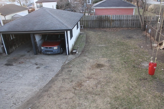 exterior space featuring a garage and an outdoor structure