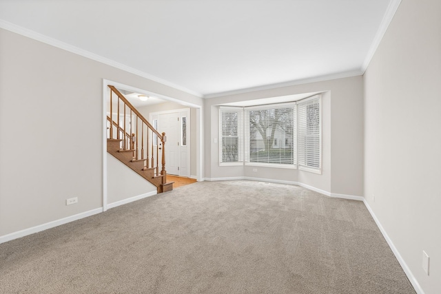 carpeted empty room with ornamental molding