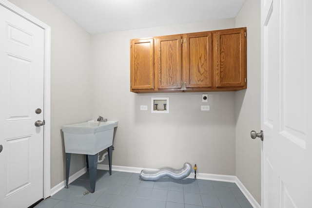 laundry room with electric dryer hookup, cabinets, and washer hookup