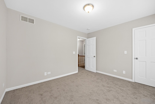 unfurnished bedroom with light carpet