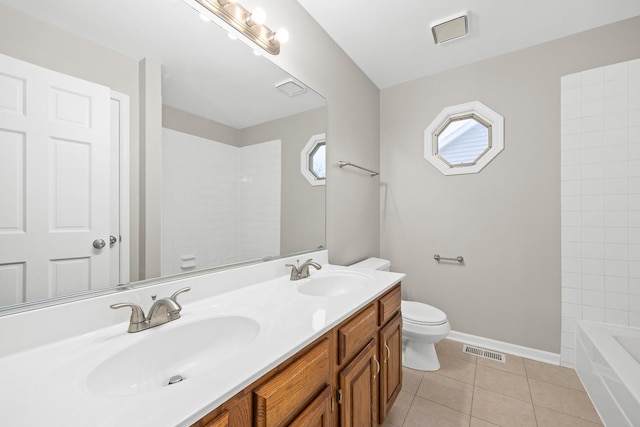 bathroom with tile patterned flooring, vanity, and toilet