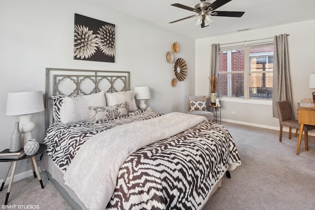 bedroom with ceiling fan and light colored carpet