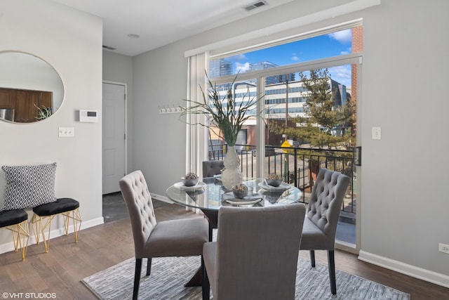 dining space featuring dark hardwood / wood-style floors