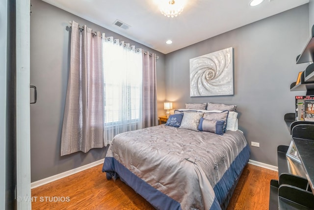 bedroom featuring dark hardwood / wood-style flooring