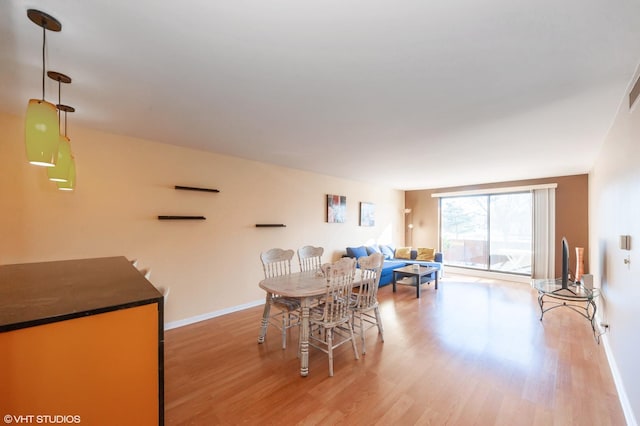 dining space featuring light hardwood / wood-style flooring