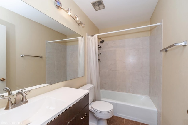 full bathroom featuring toilet, shower / bath combo with shower curtain, tile patterned floors, and vanity