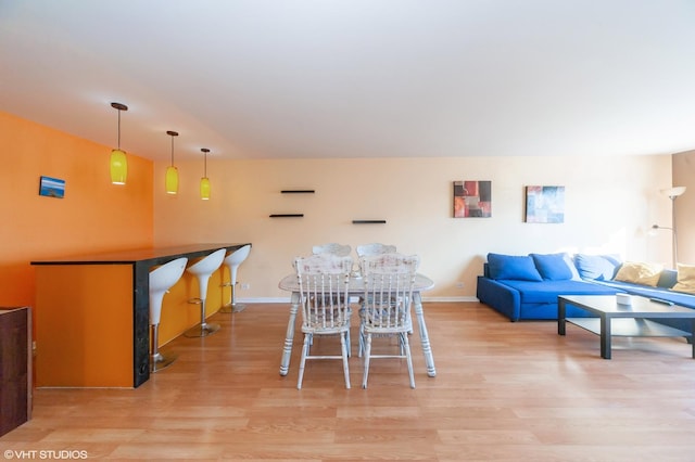 dining space featuring light wood-type flooring