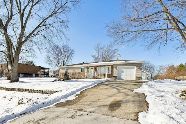 ranch-style house with a porch and a garage