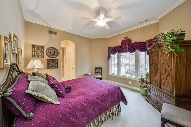 bedroom with crown molding, light colored carpet, and ceiling fan