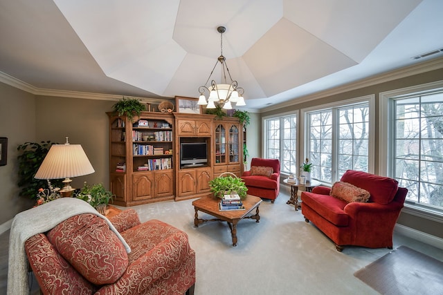 living room with a raised ceiling, crown molding, light carpet, and an inviting chandelier