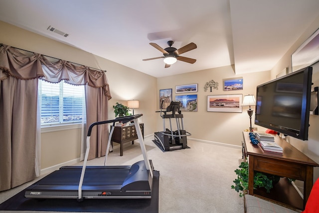 workout room with ceiling fan and carpet flooring