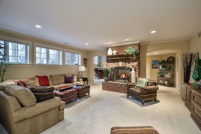 carpeted living room featuring a fireplace and ornamental molding