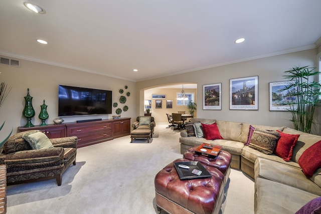 carpeted living room with crown molding