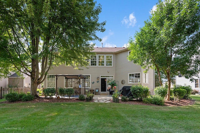 view of front facade featuring a front yard, a pergola, and a patio area