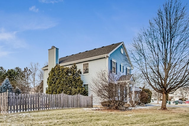 view of home's exterior with a yard