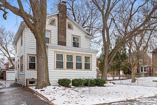 front of property with a garage and an outdoor structure