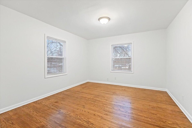 empty room with wood-type flooring