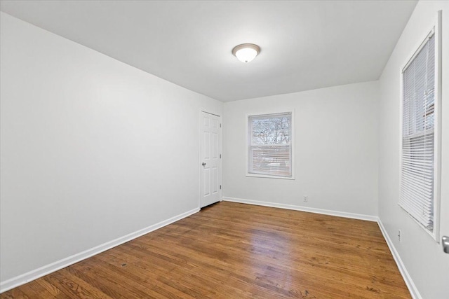 spare room with hardwood / wood-style flooring