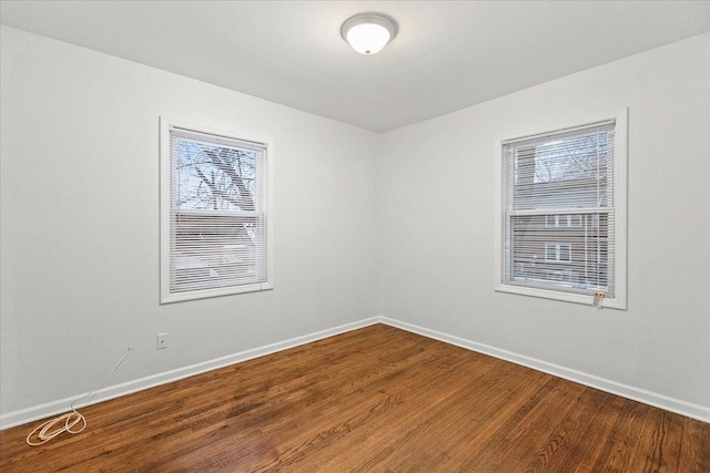 empty room with hardwood / wood-style floors