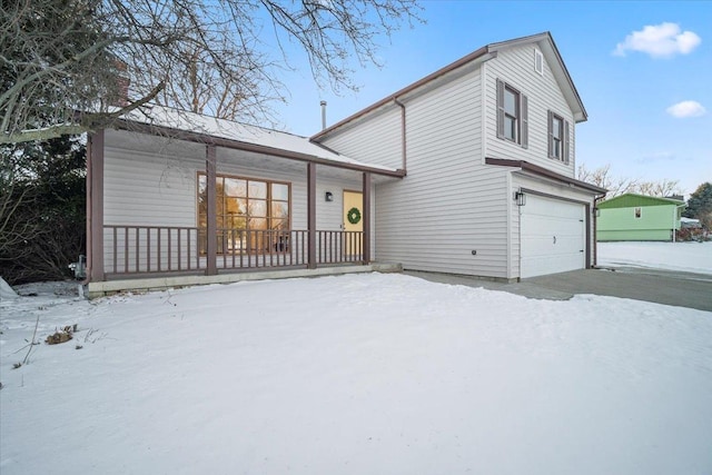 view of front of home featuring a garage and covered porch