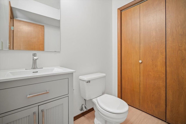 bathroom with toilet and vanity