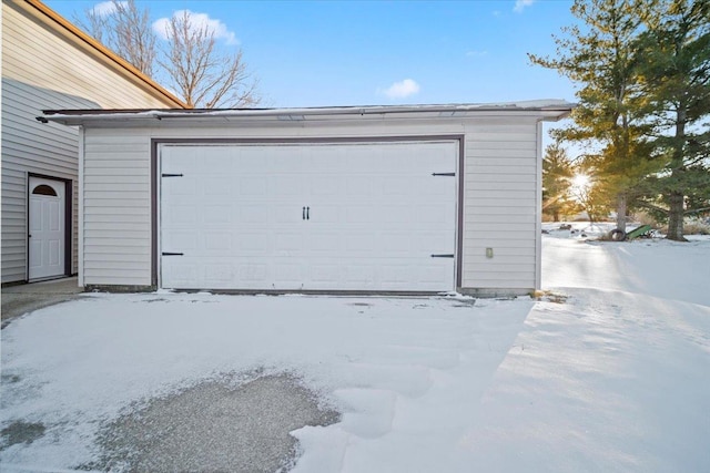 view of snow covered garage