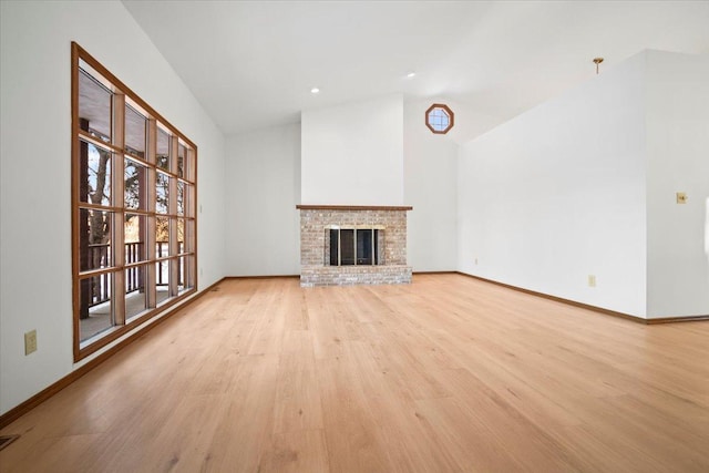 unfurnished living room featuring a fireplace and light hardwood / wood-style flooring