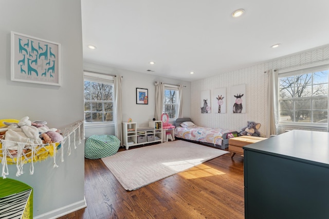 bedroom with dark hardwood / wood-style floors