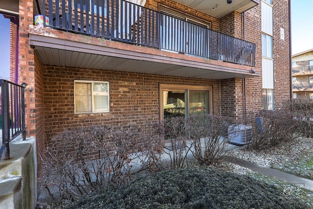 view of side of home featuring a balcony