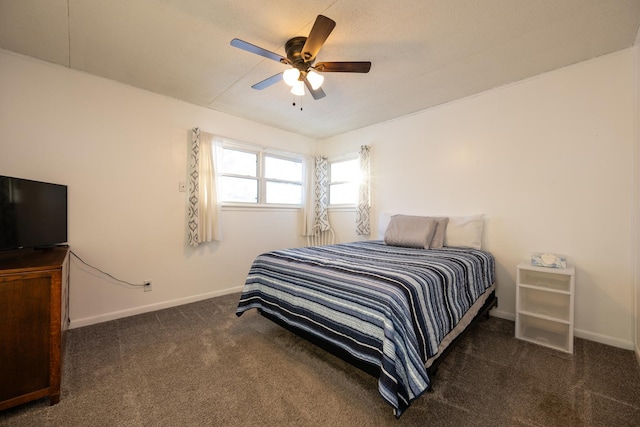 bedroom featuring a ceiling fan, carpet flooring, and baseboards