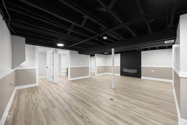 basement with light wood-type flooring