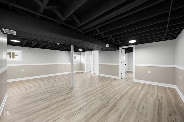 basement featuring light hardwood / wood-style flooring