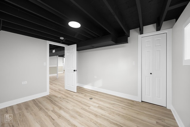 basement featuring light hardwood / wood-style floors