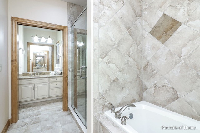 bathroom with vanity and separate shower and tub