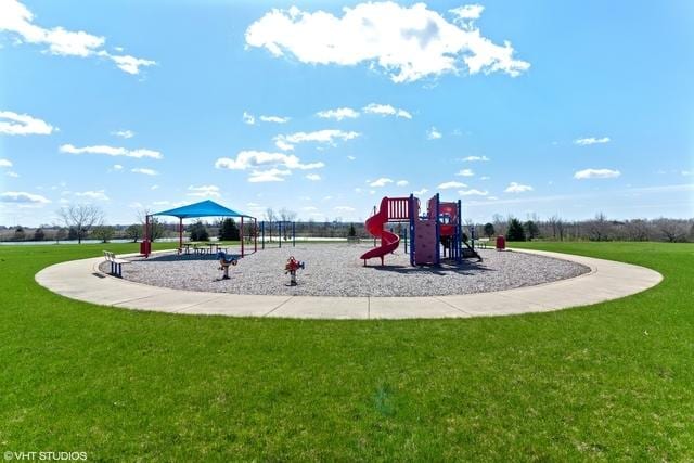 view of playground featuring a lawn and a gazebo