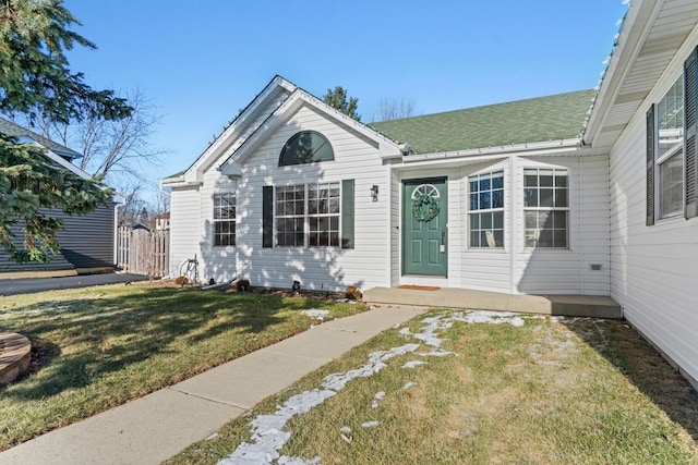 view of front of home with a front lawn