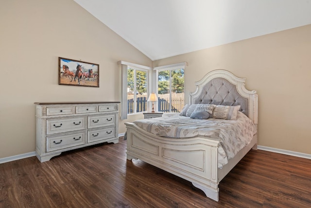 bedroom featuring lofted ceiling and dark hardwood / wood-style flooring