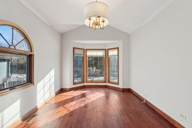 unfurnished room featuring vaulted ceiling, a chandelier, crown molding, and dark wood-type flooring