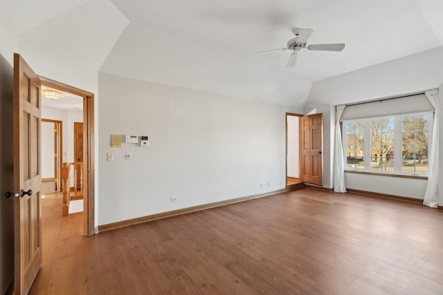 unfurnished room featuring ceiling fan, wood-type flooring, and lofted ceiling