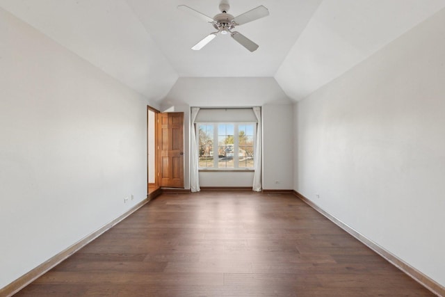 interior space with dark hardwood / wood-style floors, vaulted ceiling, and ceiling fan