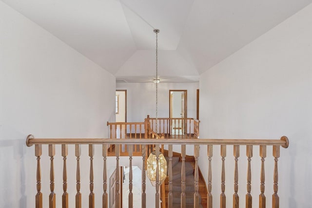 staircase with vaulted ceiling