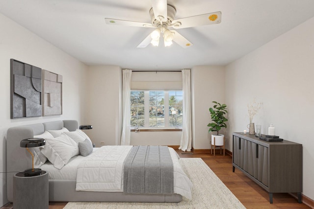 bedroom featuring wood-type flooring and ceiling fan