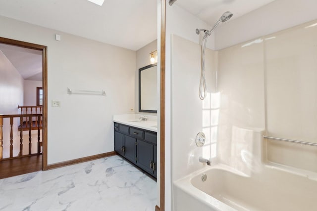 bathroom with shower / bathing tub combination and vanity